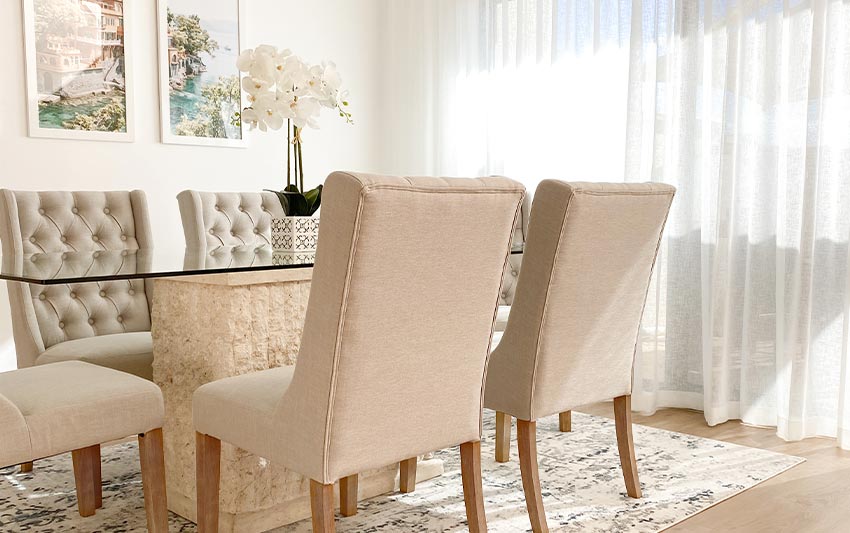 Clean sheer curtains in sunny dining room